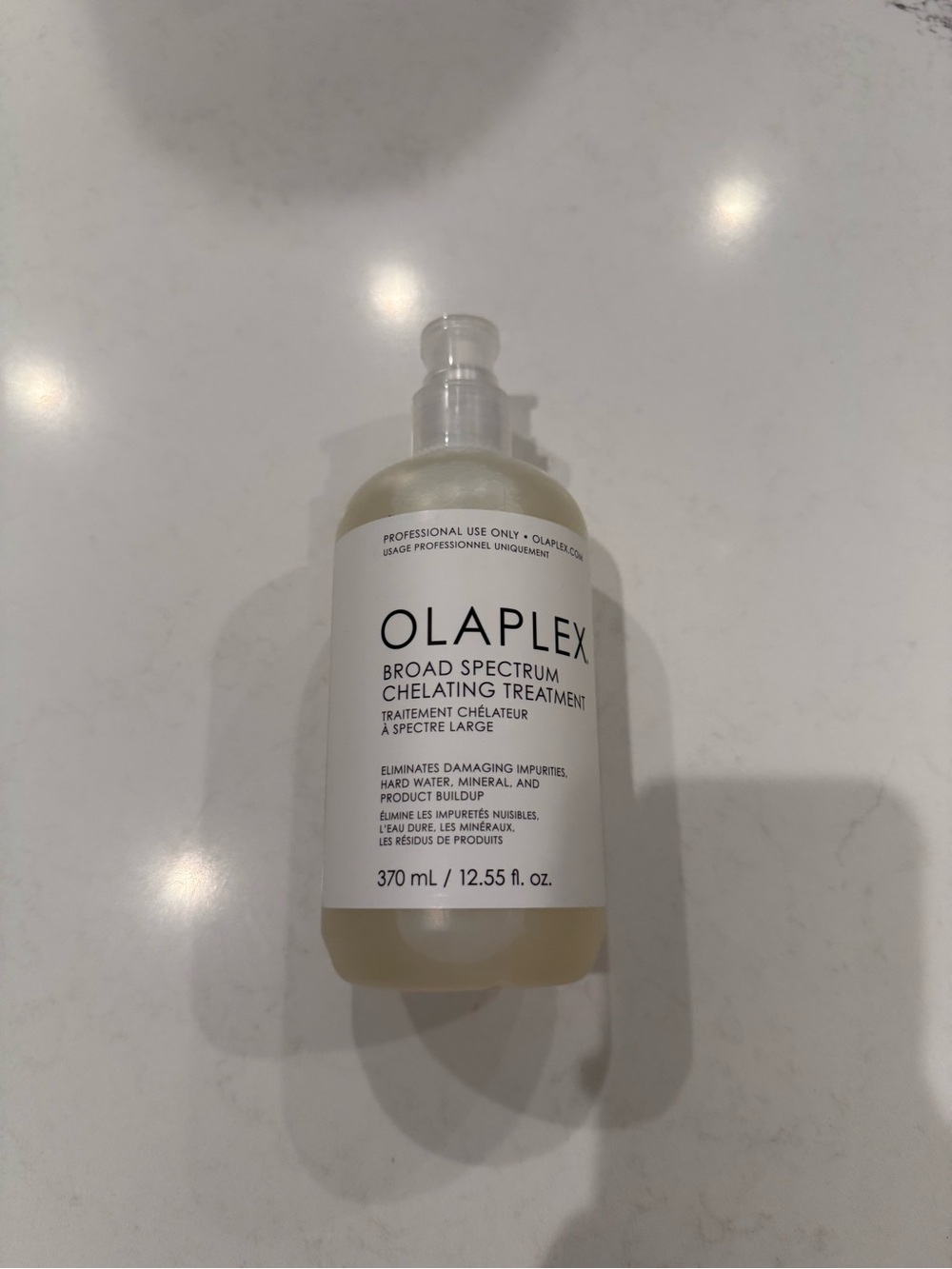 OLAPLEX Broad Spectrum Chelating Treatment β White and Clear Bottle
